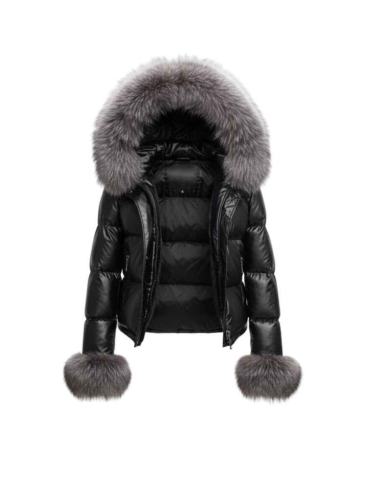 Black quilted jacket with silver fox fur-lined hood and cuffs on a white background